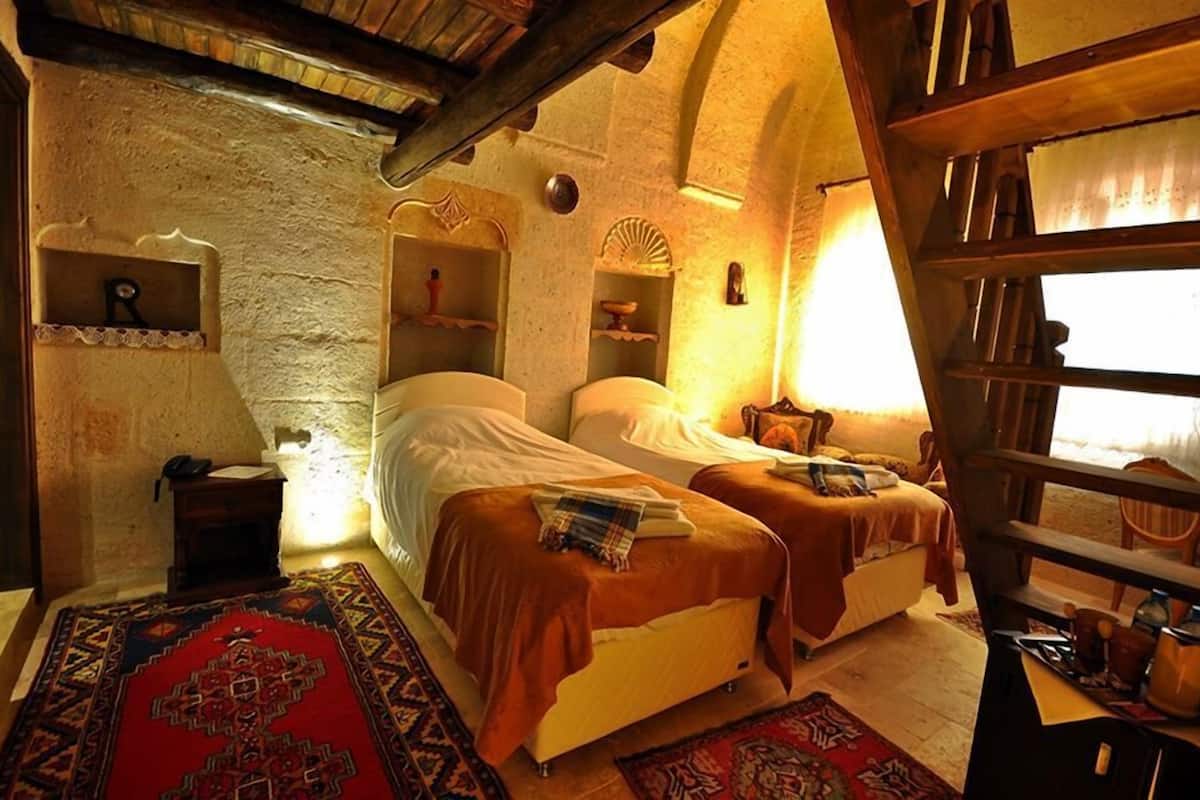 deluxe quadruple room, 1 bedroom, non smoking, courtyard view | premium bedding, minibar, in-room safe, free wifi