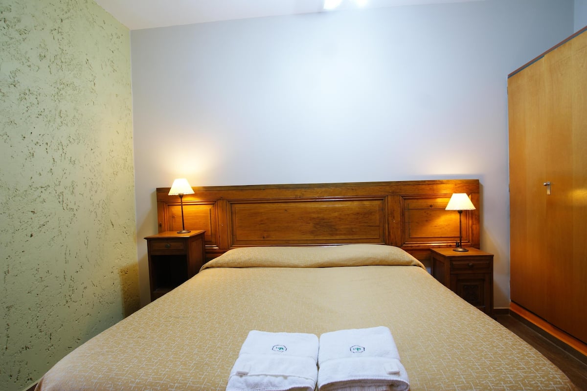 Premium bedding, down comforters, desk, laptop workspace