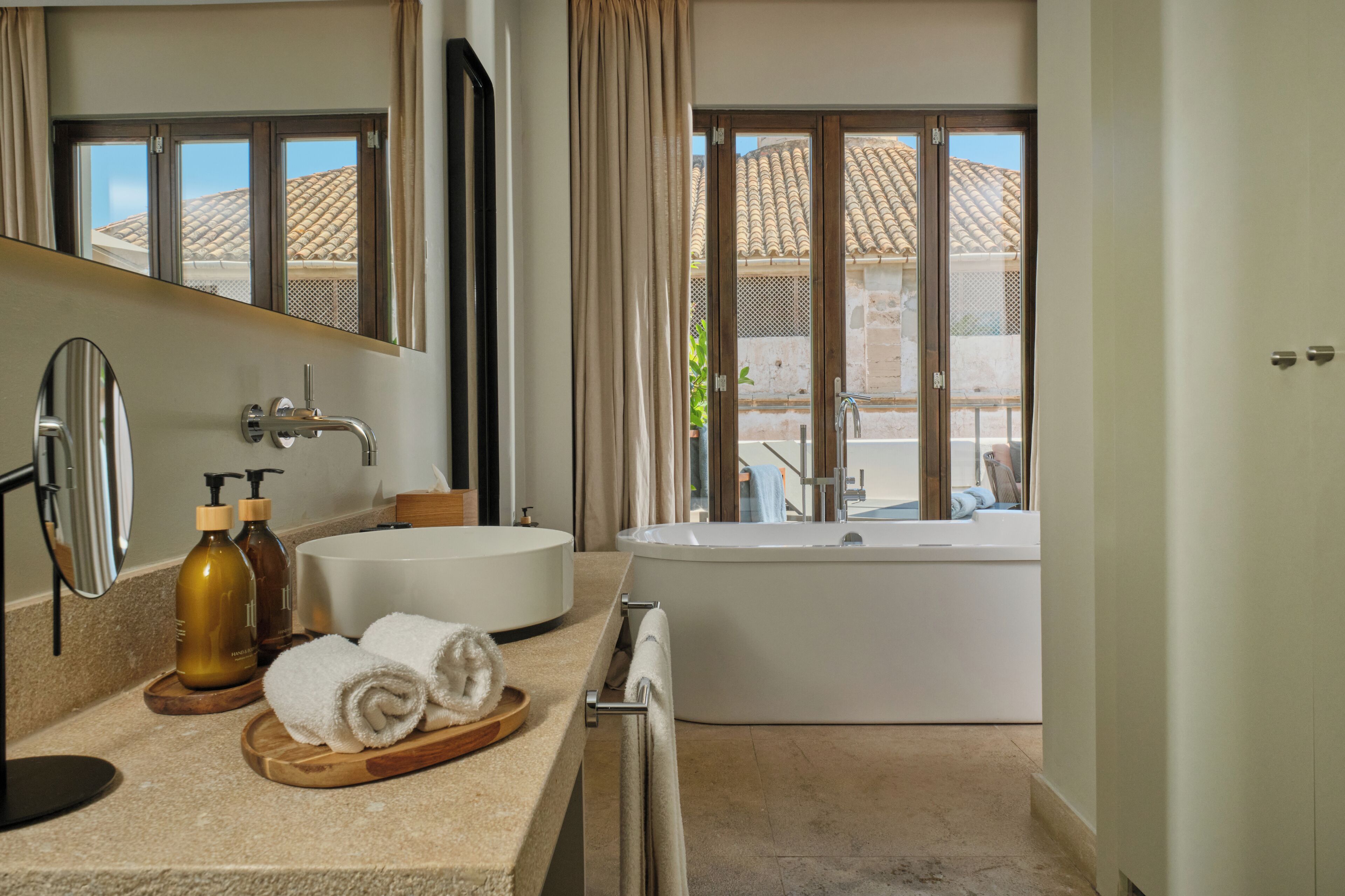 junior suite, 1 king bed, terrace | bathroom | designer toiletries, hair dryer, bathrobes, slippers