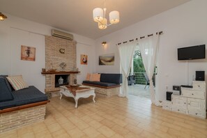 Villa, Private Pool | Living area | Flat-screen TV, fireplace