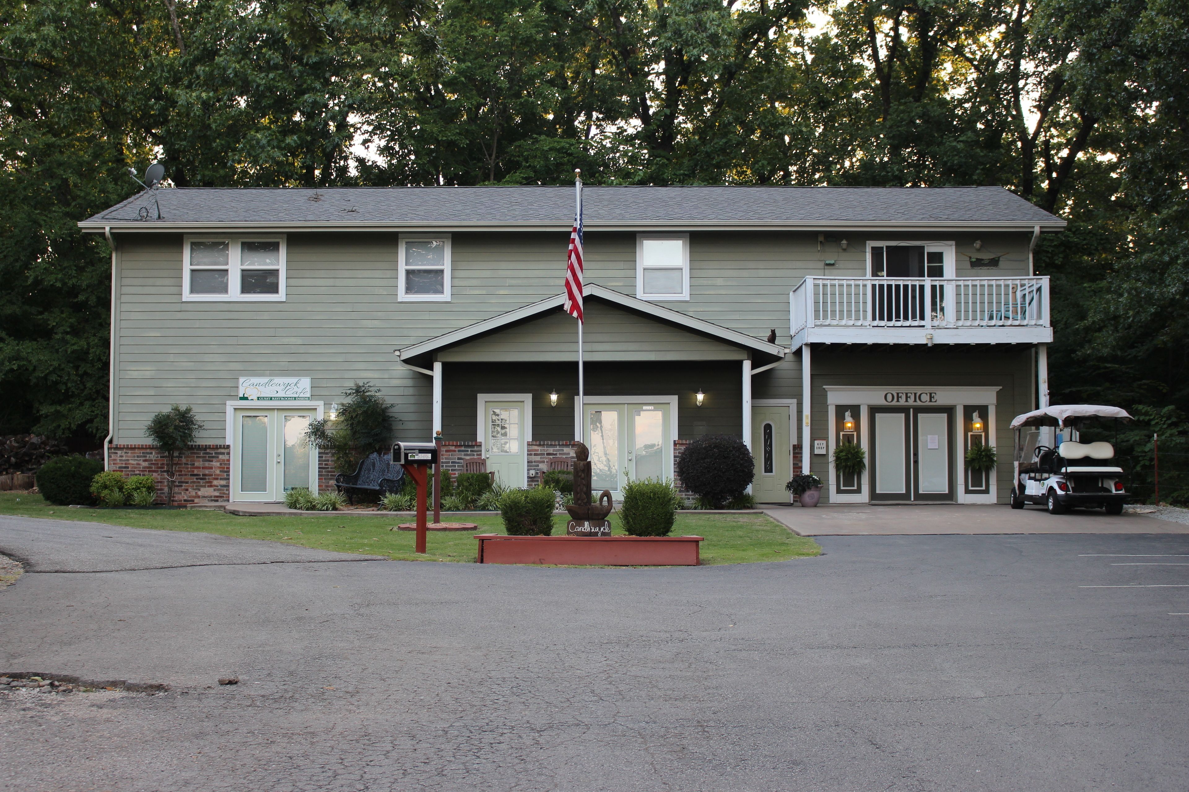 A two-story building with a sign reading "Cardwell Inn" and an "Office" sign on the second floor.