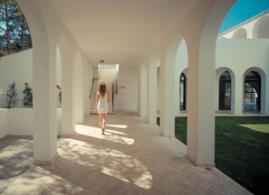 A covered walkway with columns, leading to a staircase. - Misincu (Cagnano)