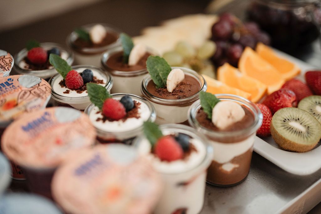 A variety of desserts and fruits on a table.