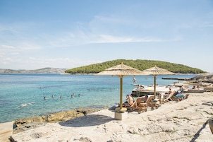 Sun loungers, beach umbrellas, beach towels, beach yoga