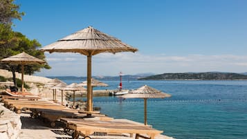 Sun-loungers, beach umbrellas, beach towels, beach yoga