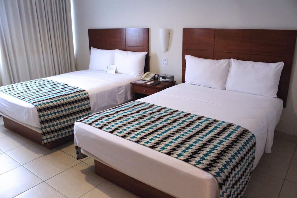 Hypo-allergenic bedding, in-room safe, desk, laptop workspace
