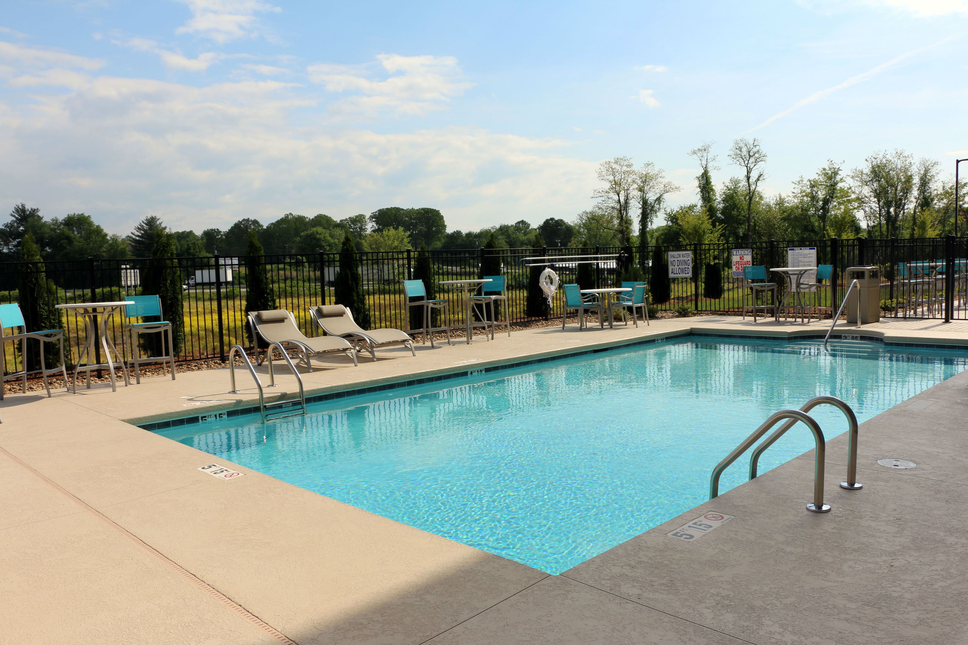 seasonal outdoor pool, open 8 am to 10 pm, pool loungers