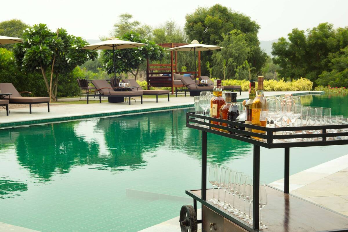 outdoor pool, pool umbrellas, pool loungers