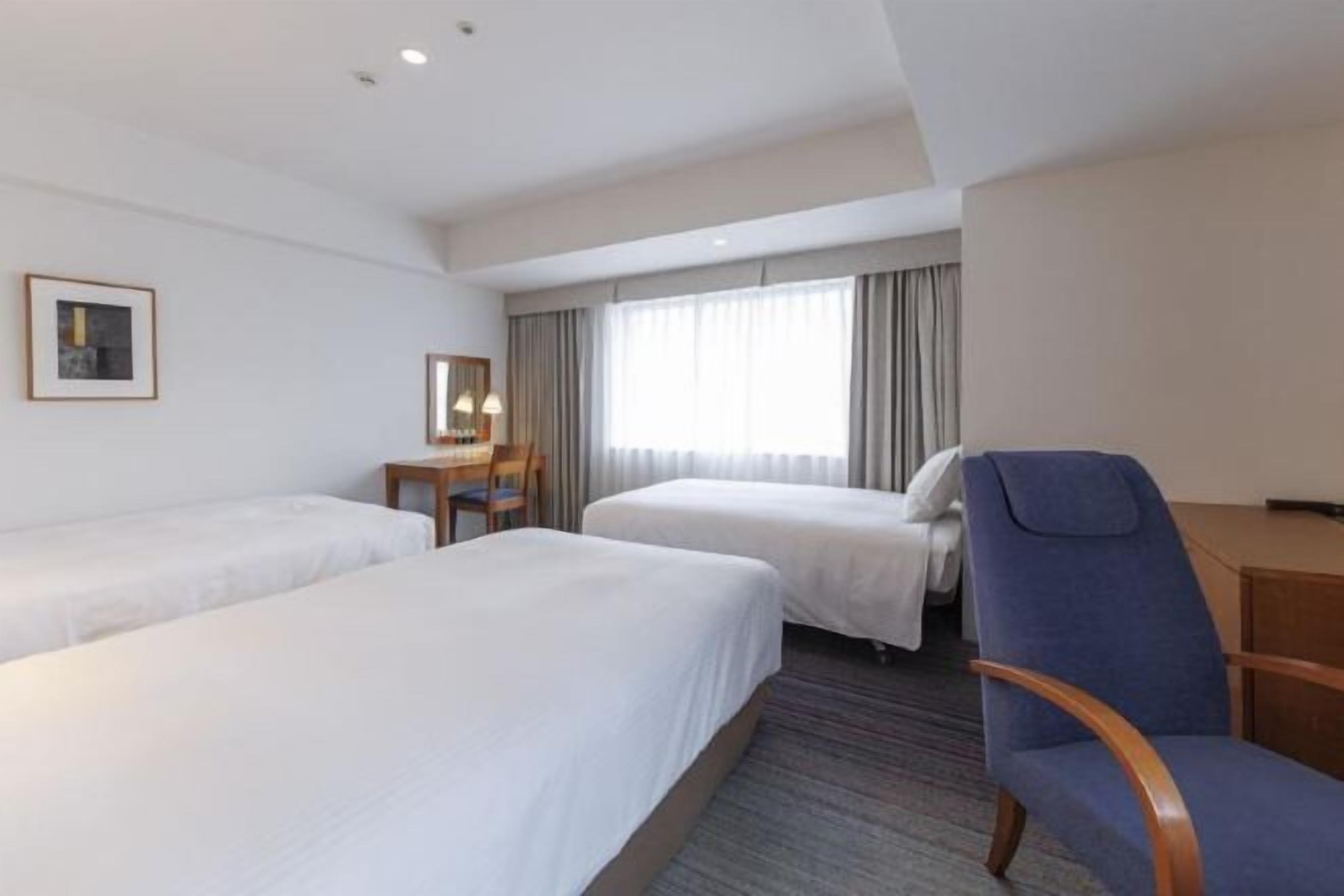 Premium bedding, down comforters, desk, laptop workspace