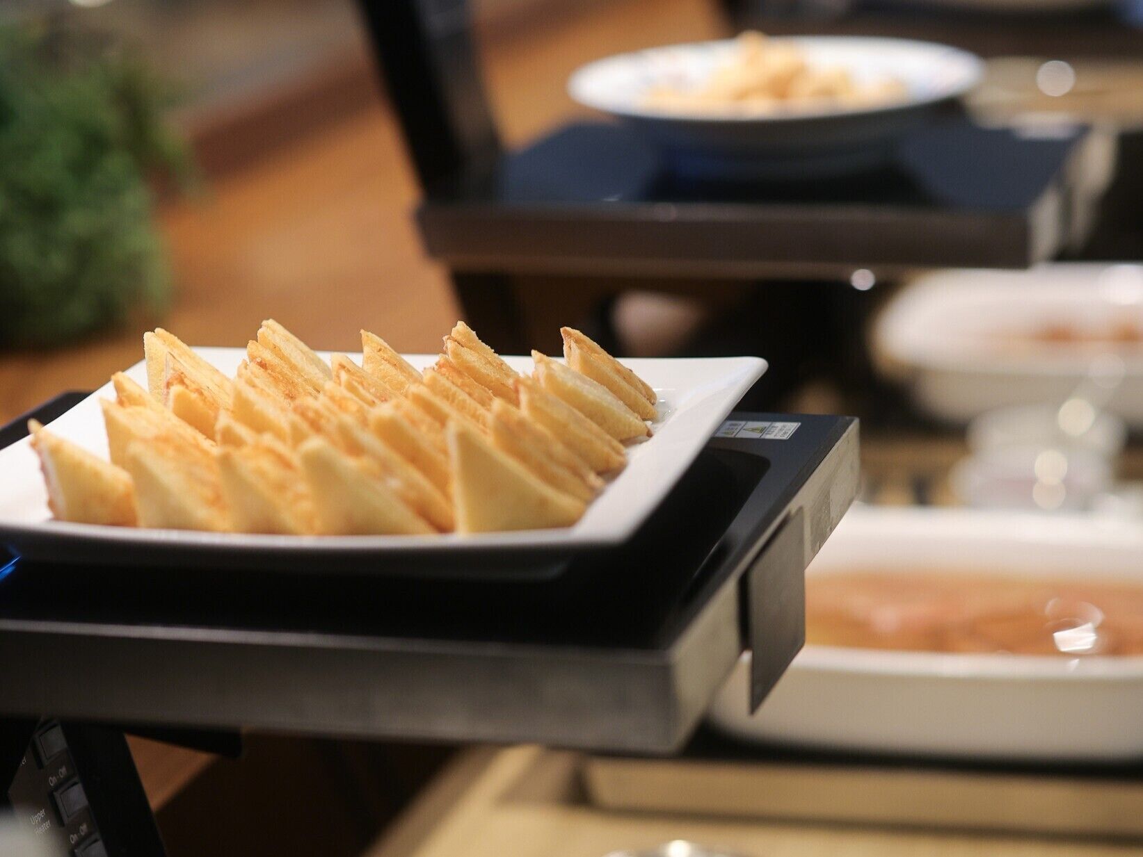 A tray with waffles on a table.
