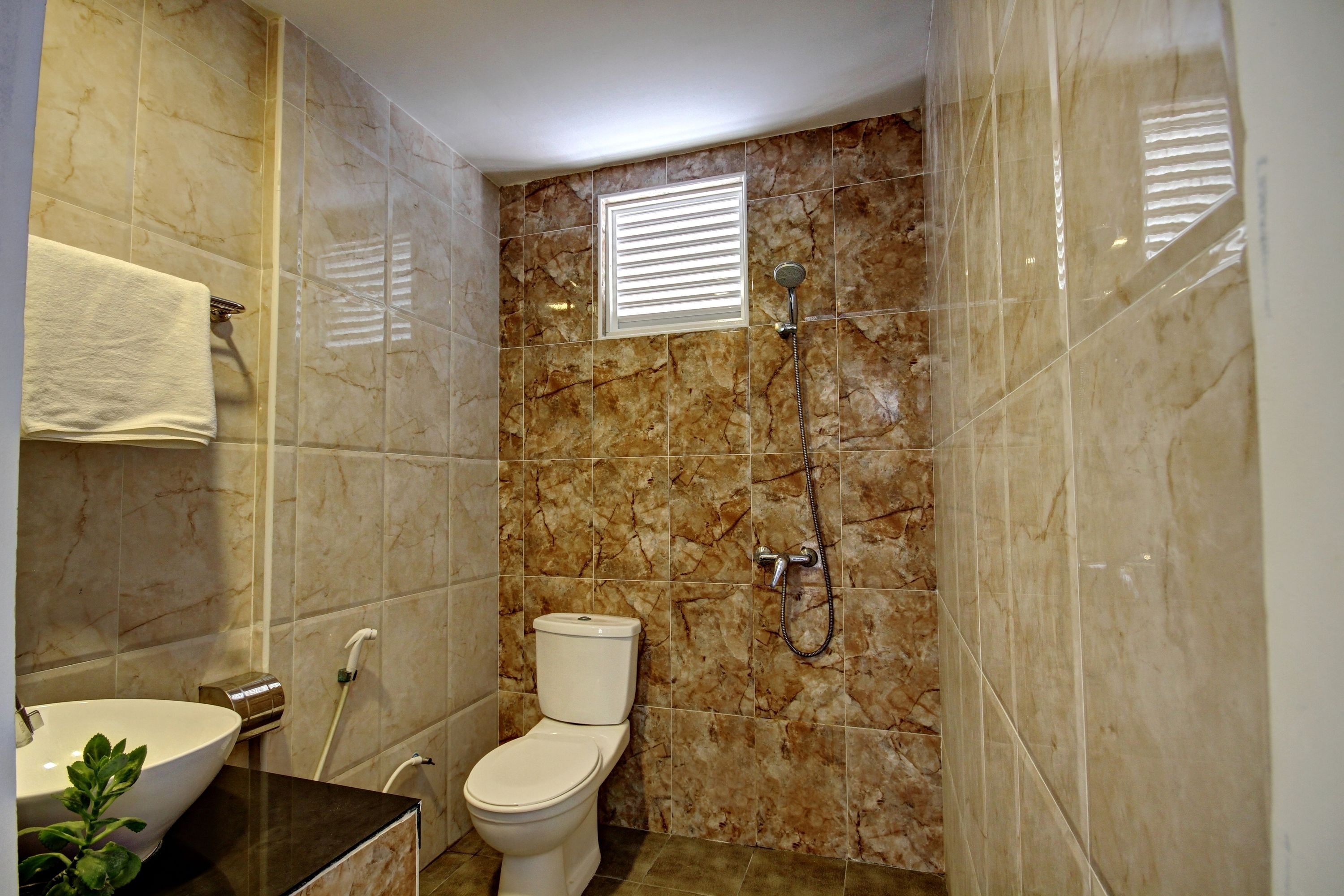 shower, designer toiletries, hair dryer, towels