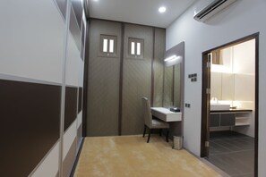 A hotel bathroom with a sink, mirror, and a shower area. - Casuarina@Pangkor (Pangkor Island)