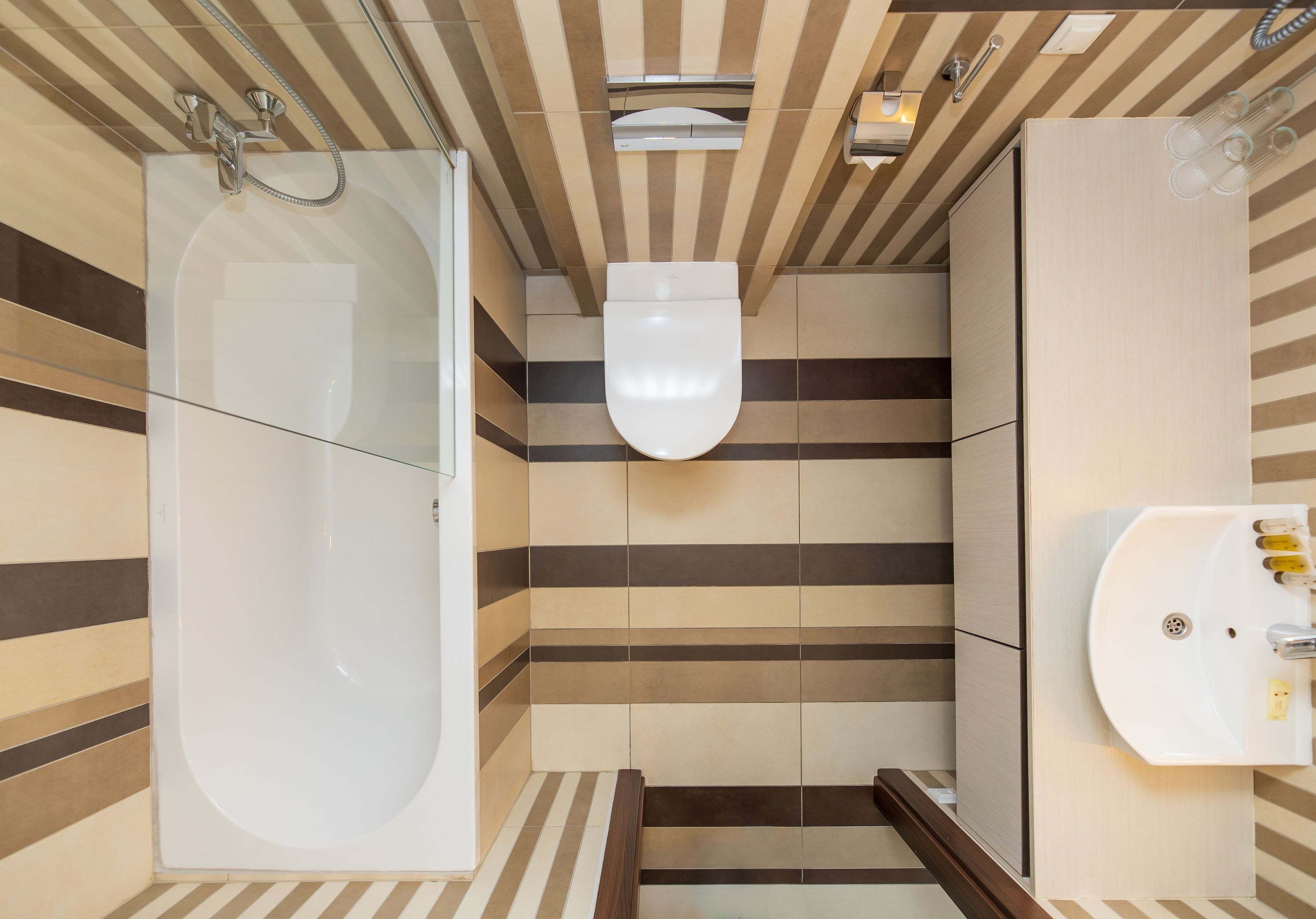 A modern bathroom with a freestanding bathtub, a toilet, and a sink.