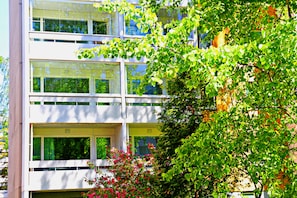 A multi-story building with large windows and balconies. - Wonderful Helsinki Apartment (Helsinki)