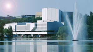 A modern building with a large fountain in front. - Wonderful Helsinki Apartment (Helsinki)