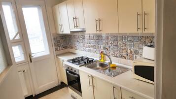 Superior Two Bedrooms Suite - Downtown | Private kitchen | Fridge, microwave, stovetop, coffee/tea maker