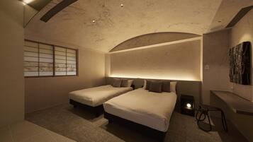 A modern bedroom with two beds, a window with a view, and a unique ceiling design.