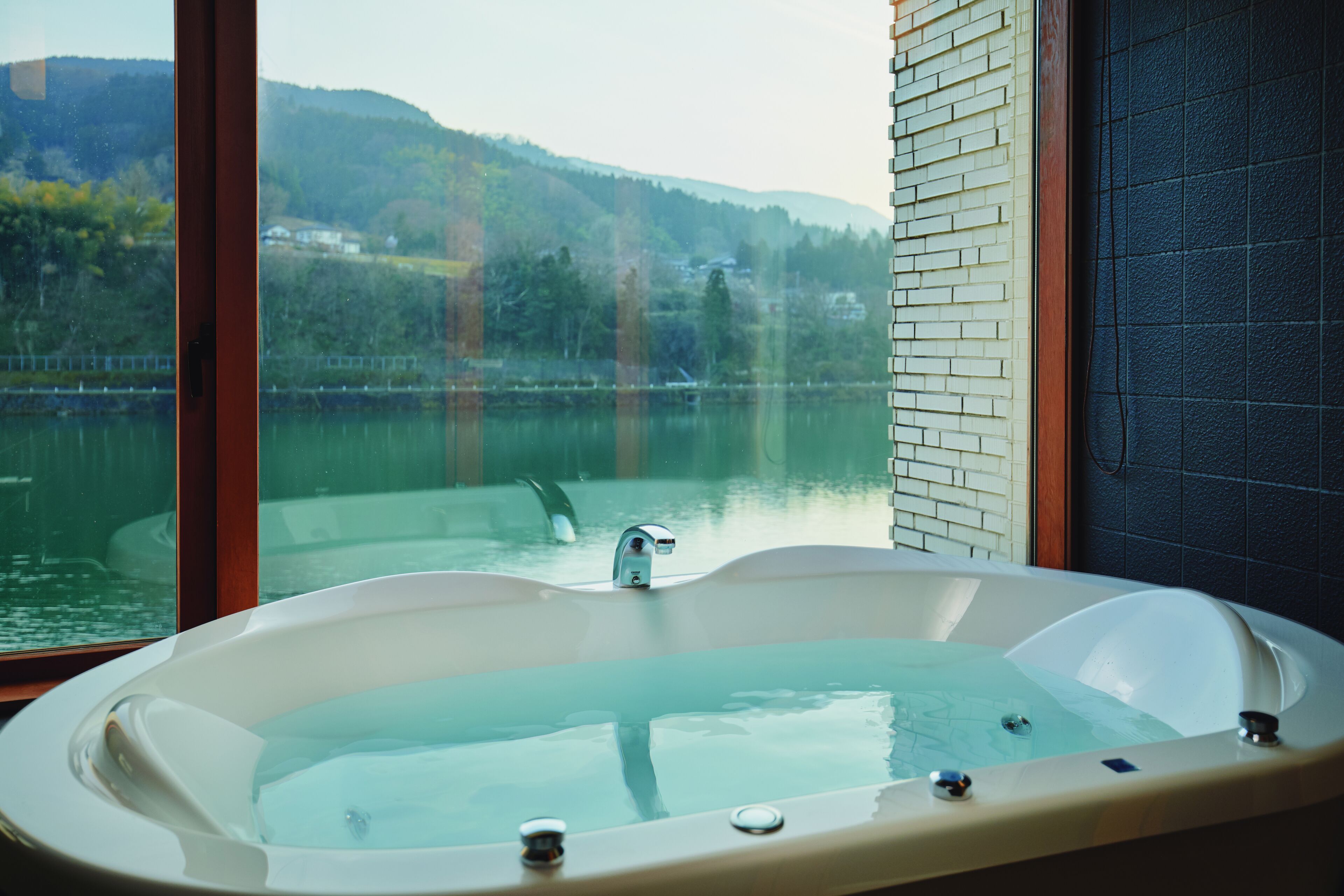 deluxe room, 2 bedrooms, non smoking, river view (211) | bathroom | free toiletries, hair dryer, bathrobes, slippers