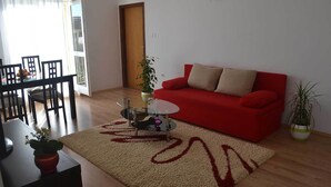 Apartment, 2 Bedrooms, Balcony, Partial Sea View | Living area