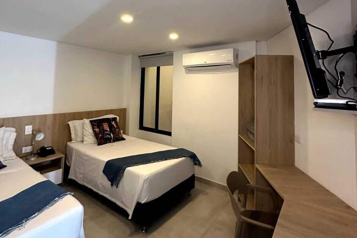 Twin Room | Blackout drapes, WiFi (free), bed sheets