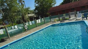 A clear swimming pool with a 'NO DIVING' sign at the bottom. - Gulfway Motel & Restaurant (High Island)