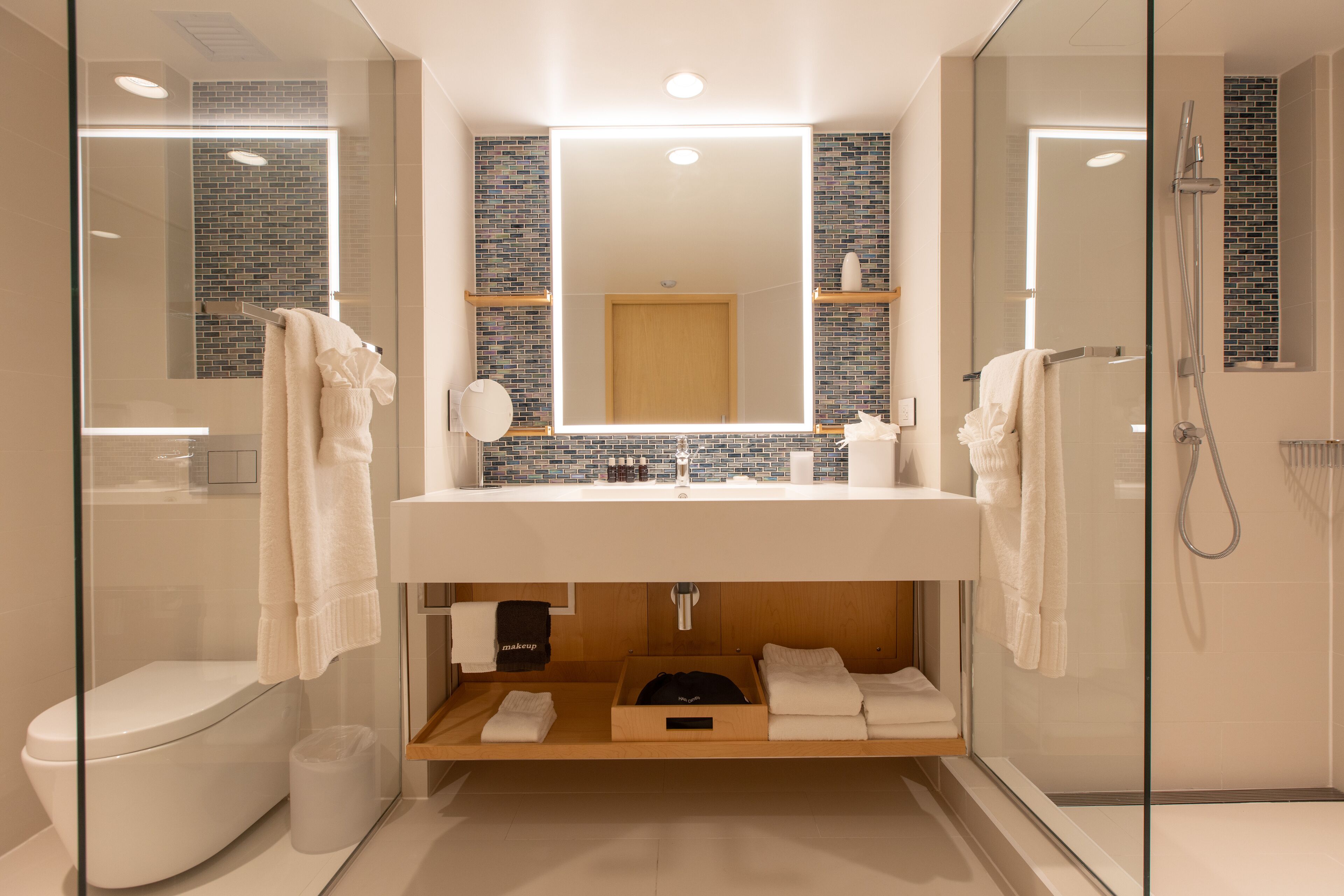 junior oceanfront suite | bathroom | shower, rainfall showerhead, designer toiletries, hair dryer
