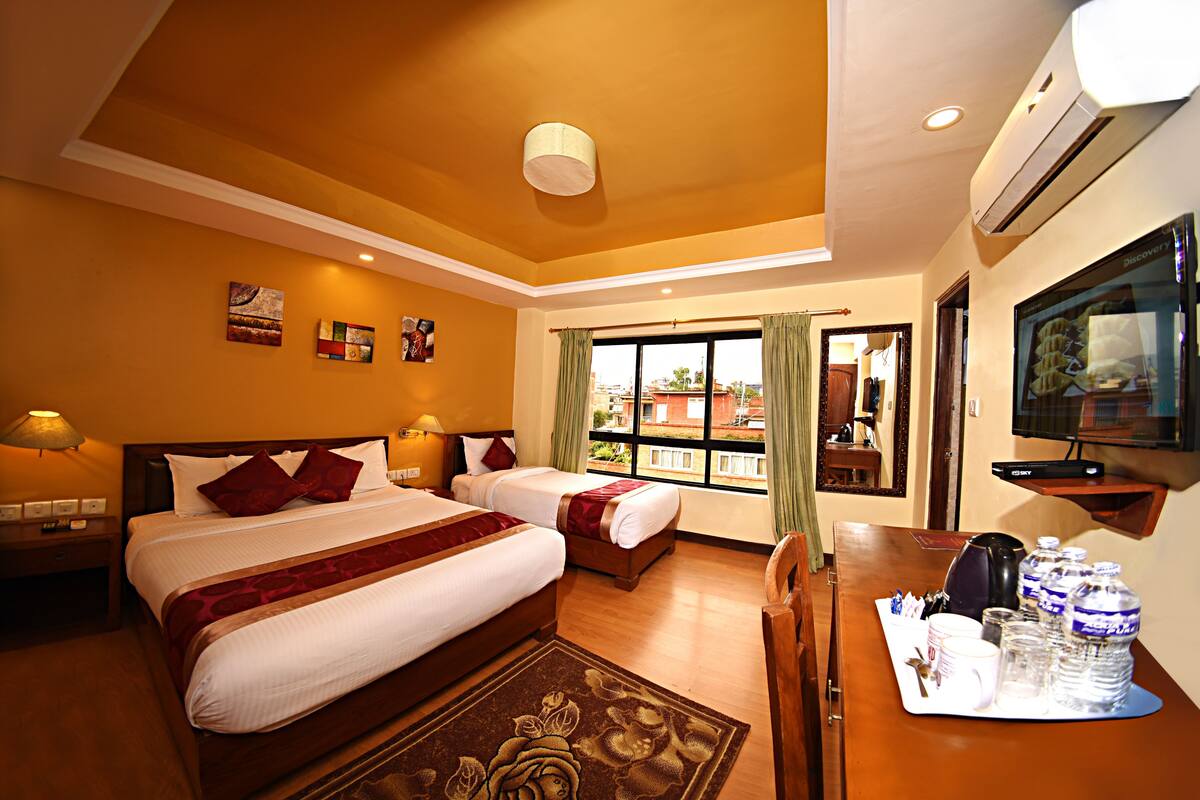 Family Deluxe Room | In-room safe, desk, blackout drapes, soundproofing