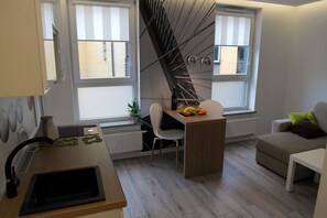 Studio (Golden House, Rydygiera 16) | Living area | Flat-screen TV