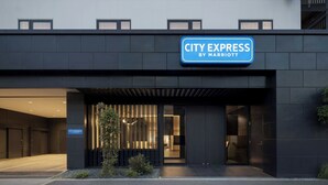 A modern building with a sign reading 'CITY EXPRESS BY MARRIOTT'. - City Express By Marriott Osaka Shin-Imamiya (Osaka)