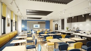 A modern dining area with tables and chairs, a projection screen, and a kitchen counter with food items. - City Express By Marriott Osaka Shin-Imamiya (Osaka)