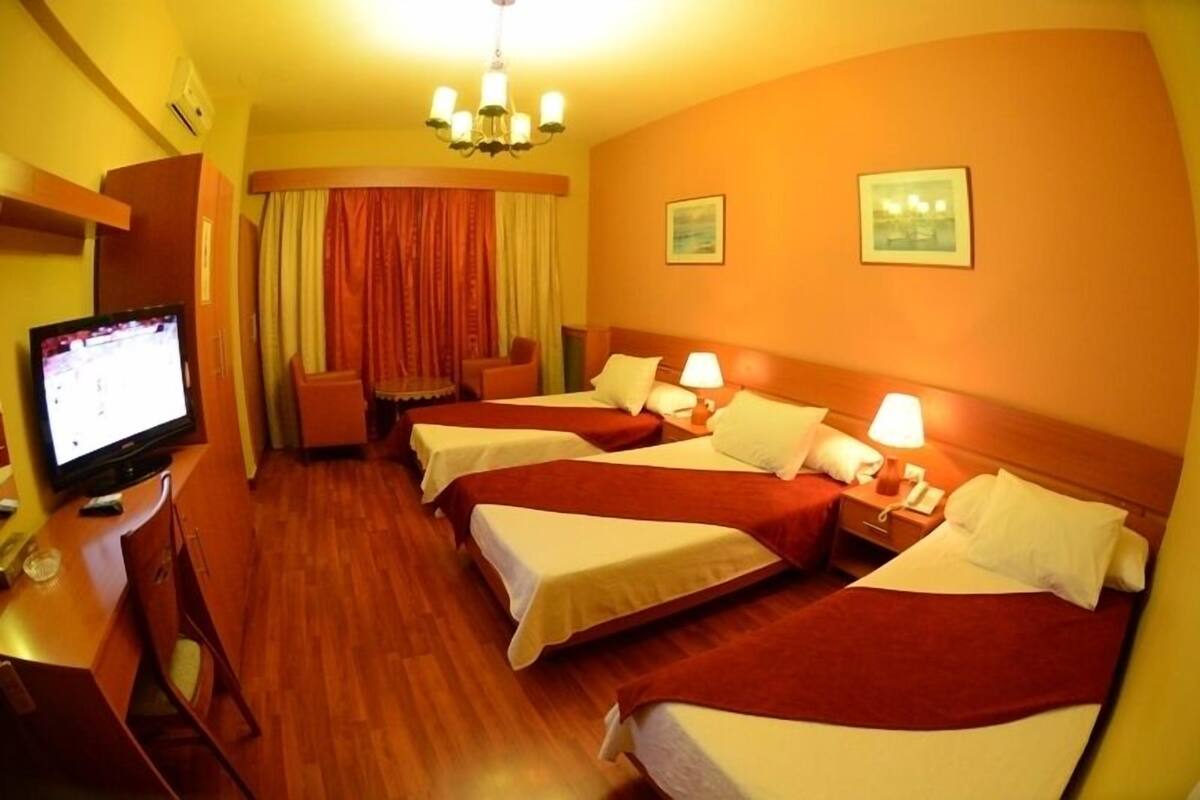 Triple Room | Minibar, in-room safe, blackout drapes, iron/ironing board (on request)