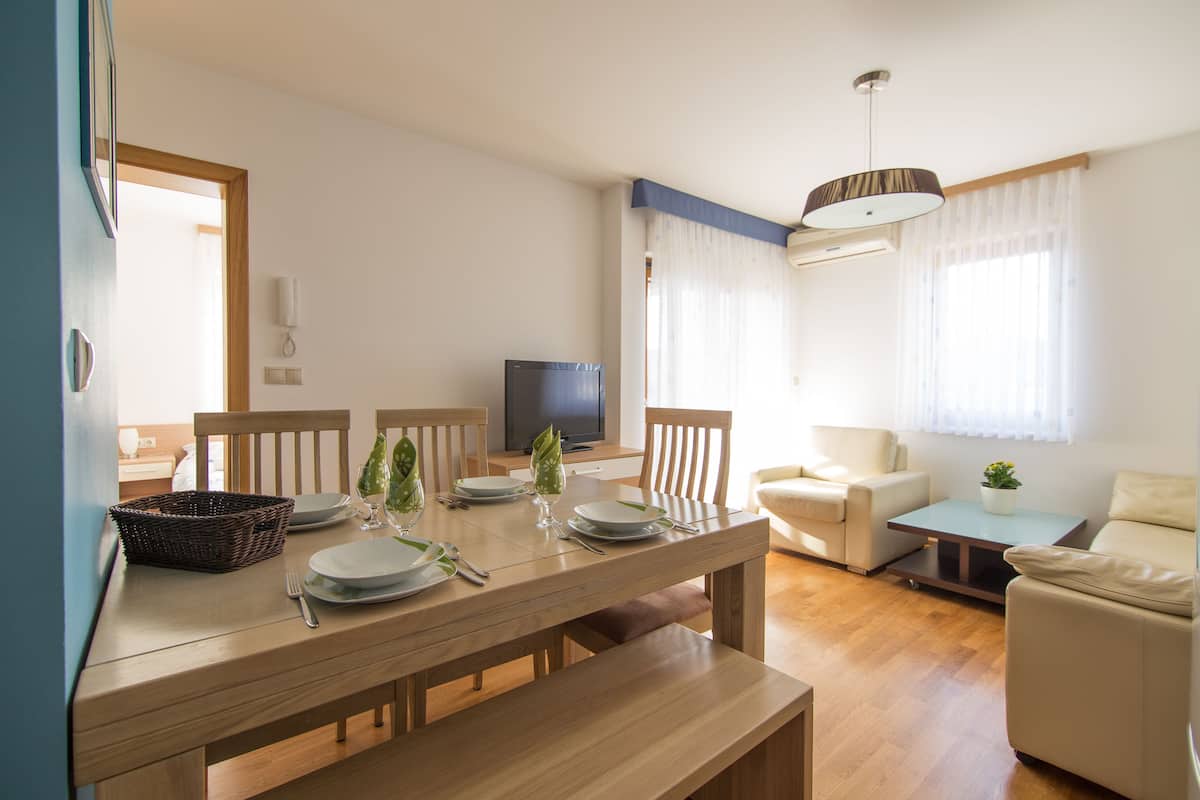 Standard Apartment, 2 Bedrooms, Balcony, Sea View | Living room | Flat-screen TV