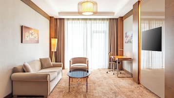 Executive Suite, 1 King Bed with Sofa bed | Living area | Flat-screen TV