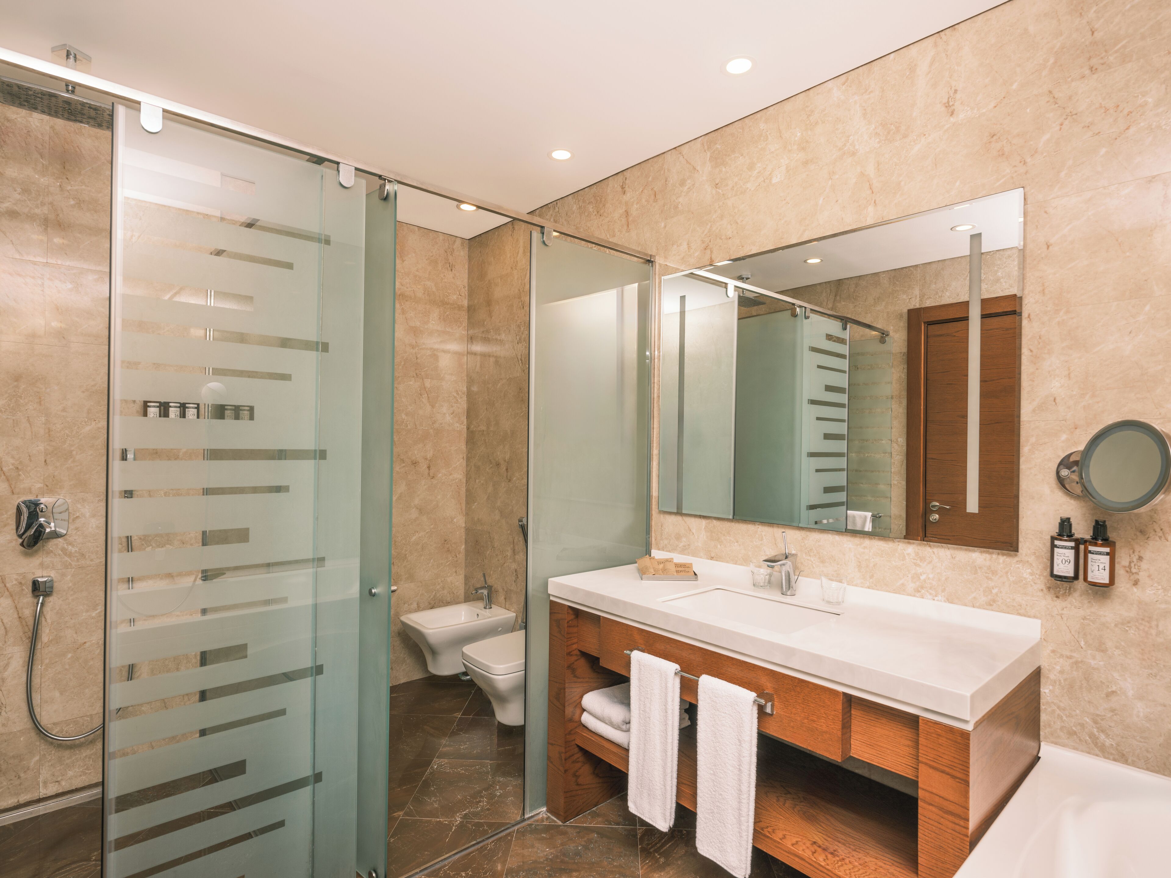 executive suite, 1 king bed with sofa bed | bathroom | free toiletries, hair dryer, slippers, towels