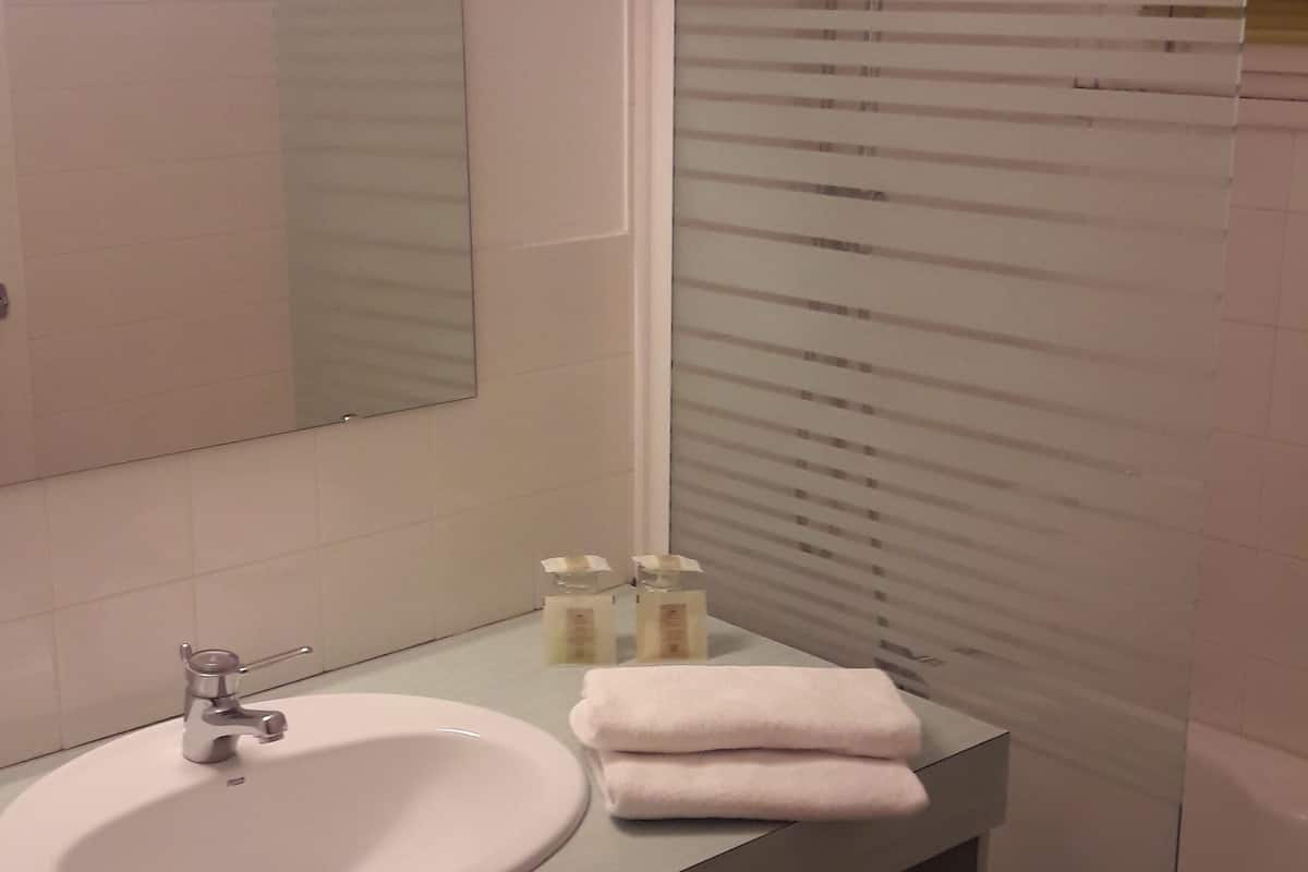 standard twin room, garden area | bathroom | rainfall showerhead, hair dryer, towels