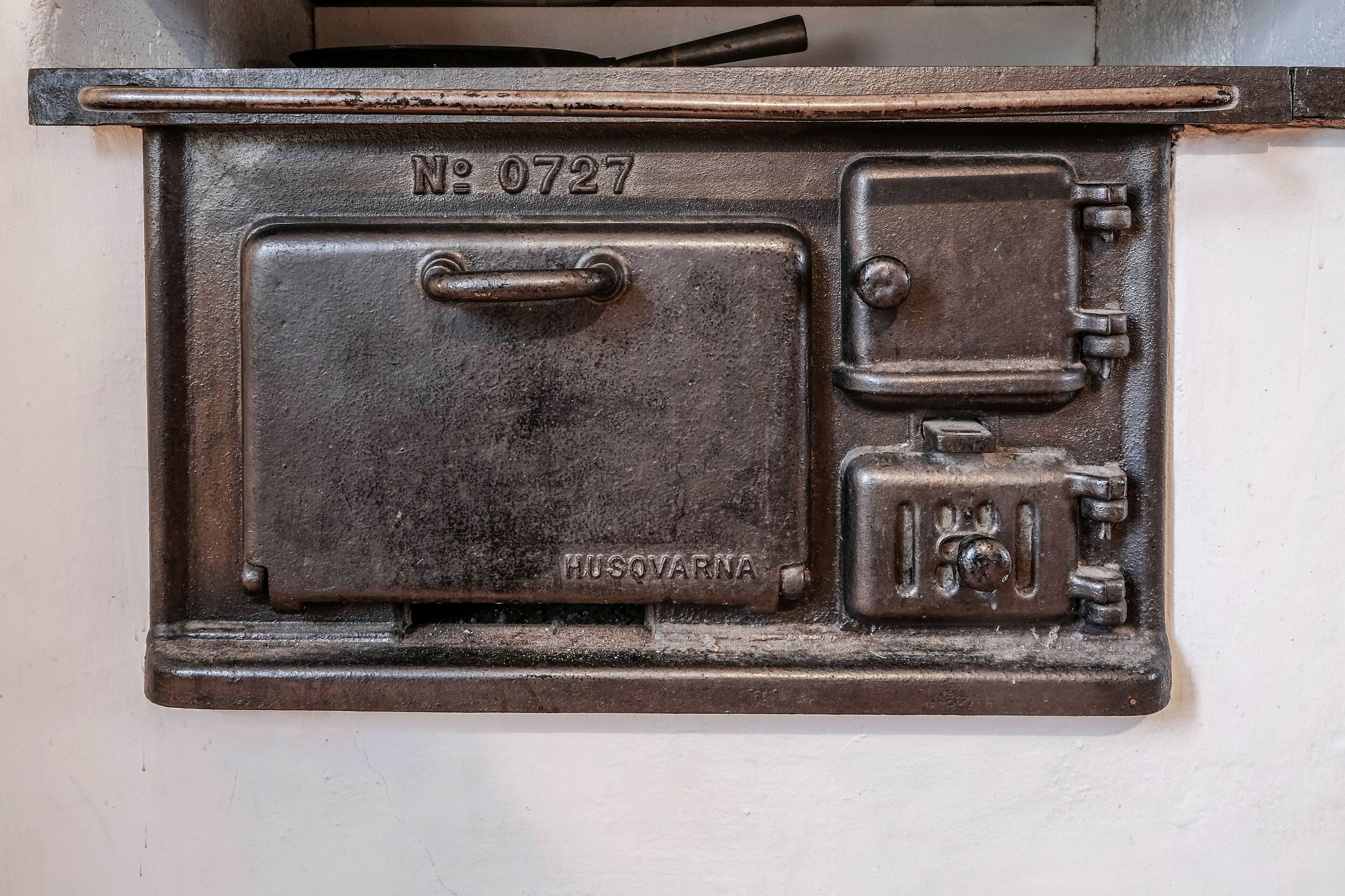A metal utility box with the number "0727" and the brand "HUSQVARNA".