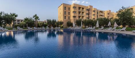 Outdoor pool, pool umbrellas, pool loungers