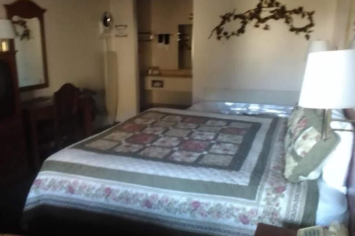 Desk, blackout drapes, iron/ironing board, bed sheets