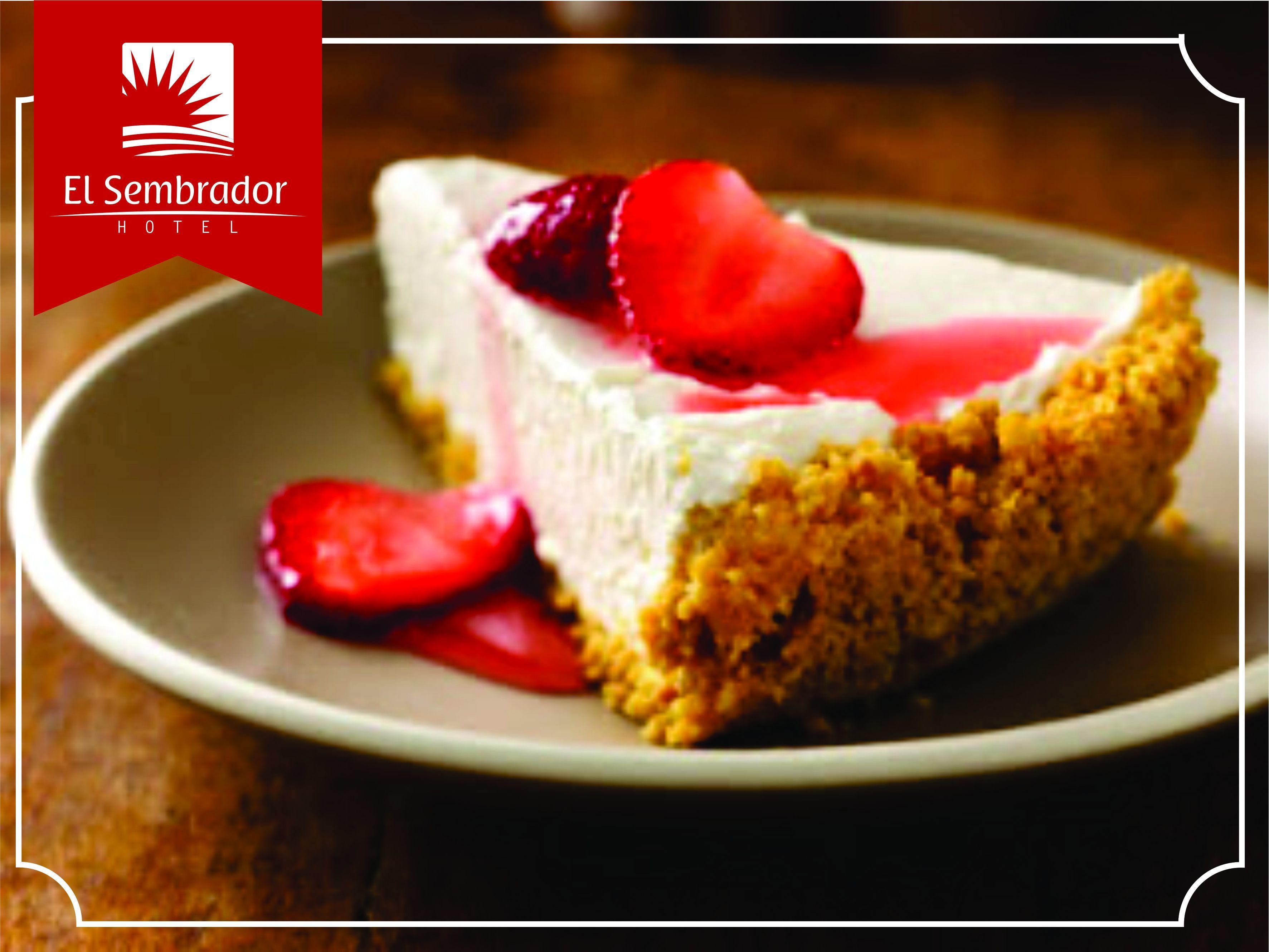 A slice of cheesecake with strawberries on a plate.