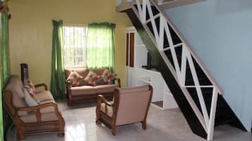 Suite, 2 Bedrooms, Kitchenette, Garden View | Living area | Flat-screen TV