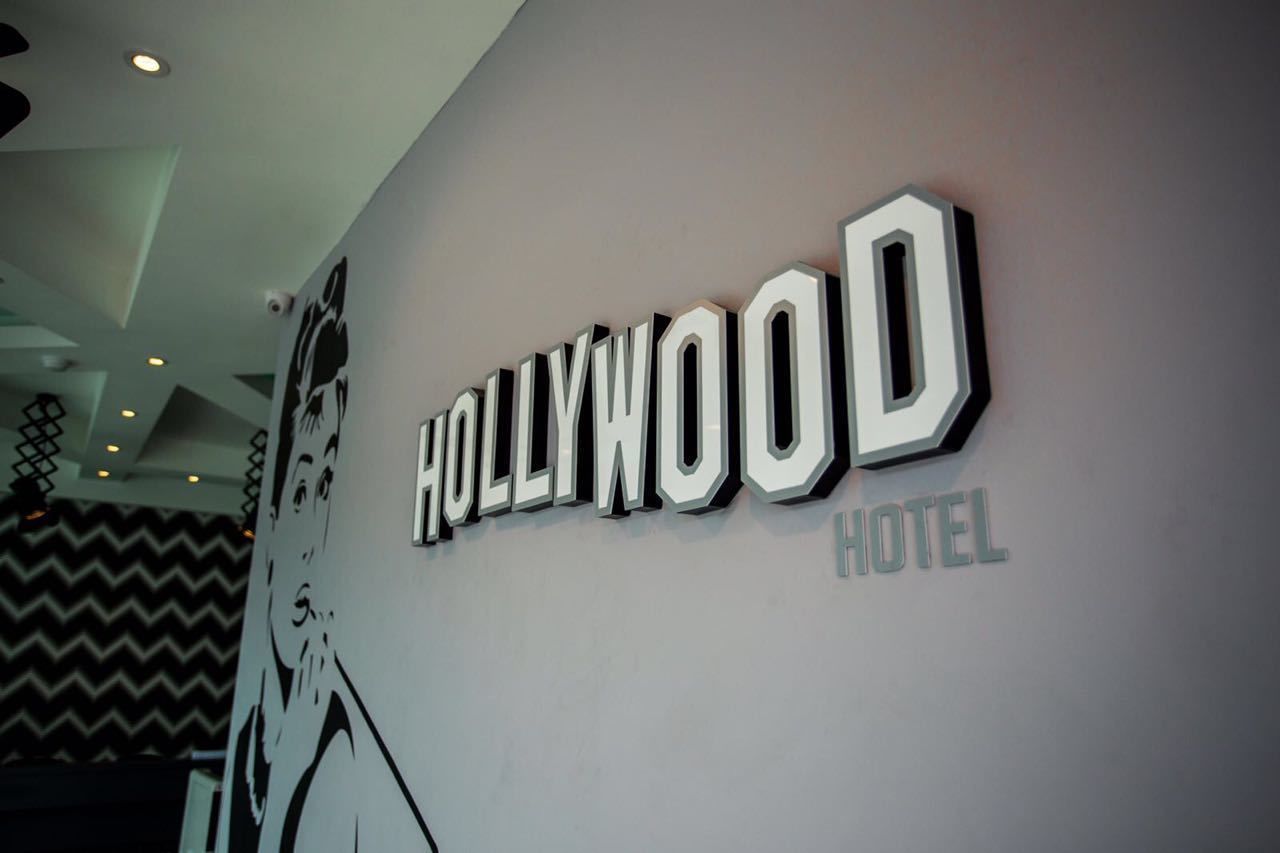 A hotel sign with the name "HOLLYWOOD HOTEL" in bold, capital letters.