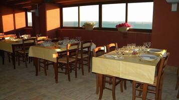 Breakfast, lunch, dinner served; local cuisine