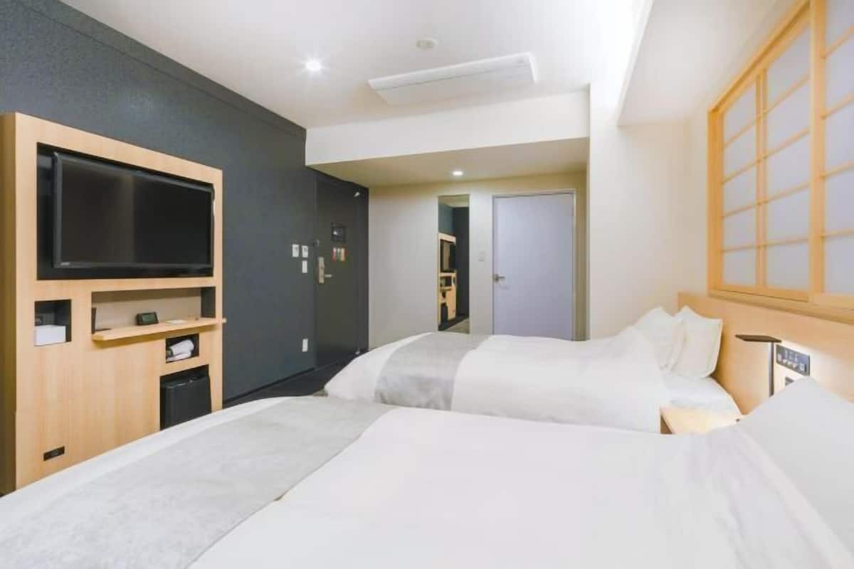 Premium bedding, down duvets, in-room safe, desk