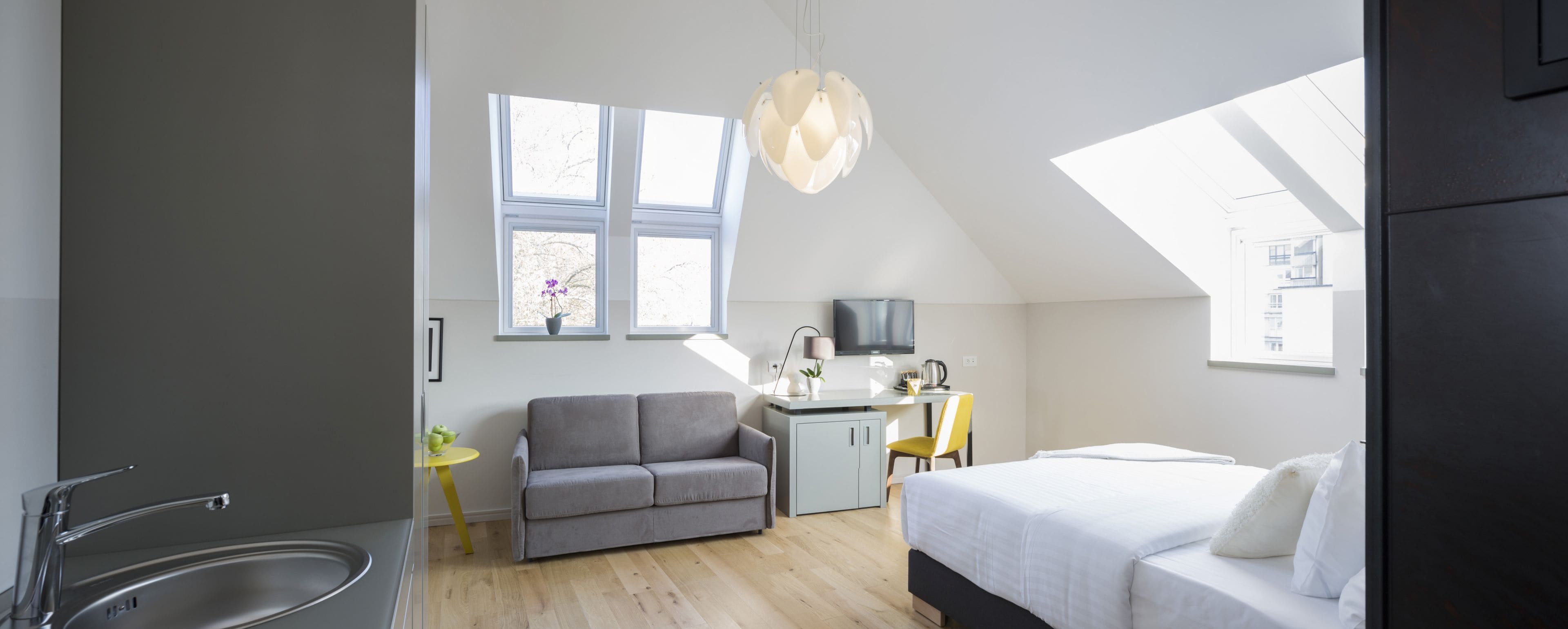 junior studio suite, city view | premium bedding, minibar, in-room safe, desk