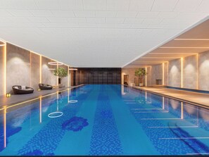 Een zwembad met een geometrisch tegelpatroon, omgeven door muren met inbouwverlichting en een modern ontwerp.