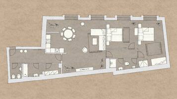 Plano de planta de un hotel que incluye comedor, cocina y varias habitaciones.