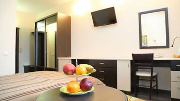 Minibar, desk, laptop workspace, iron/ironing board