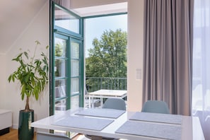 Deluxe Apartment, 1 Bedroom, Non Smoking | Living area | Flat-screen TV, heated floors