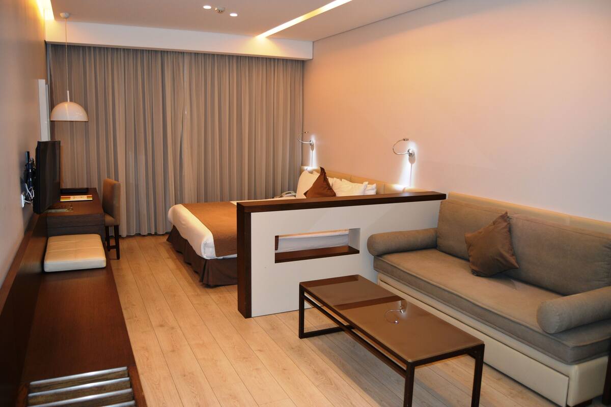 Superior Studio | Living area | Flat-screen TV