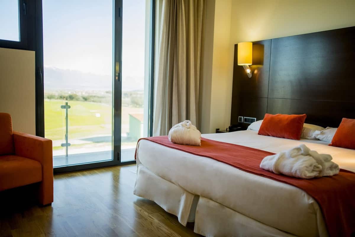 junior suite | 1 bedroom, in-room safe, individually furnished, desk